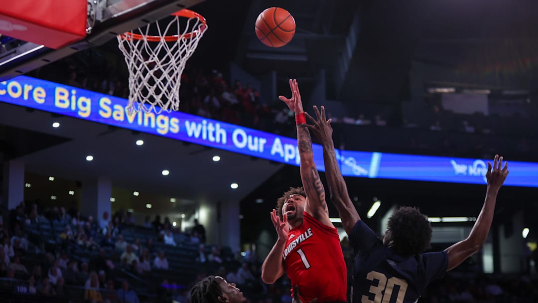 Feb 1, 2025; Atlanta, Georgia, USA; Louisville Cardinals guard J'Vonne Hadley (1) shoots against the Georgia Tech Yellow Jackets in the first half at McCamish Pavilion. Mandatory Credit: Brett Davis-Imagn Images