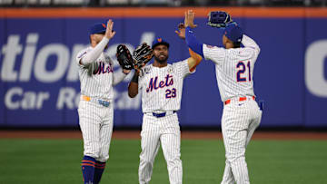 Sep 16, 2025; New York City, New York, USA; New York Mets left fielder Brandon Nimmo (9) and center fielder Cedric Mullins (28) and right fielder Juan Soto (22) celebrates after defatting the San Diego Padres at Citi Field. Mandatory Credit: Vincent Carchietta-Imagn Images