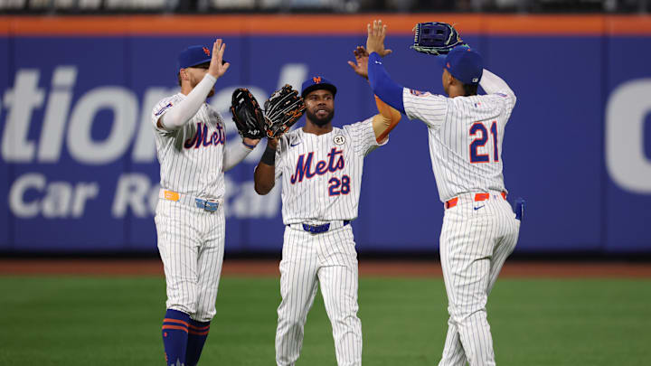 Sep 16, 2025; New York City, New York, USA; New York Mets left fielder Brandon Nimmo (9) and center fielder Cedric Mullins (28) and right fielder Juan Soto (22) celebrates after defatting the San Diego Padres at Citi Field. Mandatory Credit: Vincent Carchietta-Imagn Images