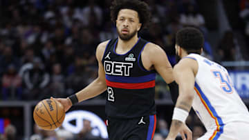 Cade Cunningham dribbles the ball