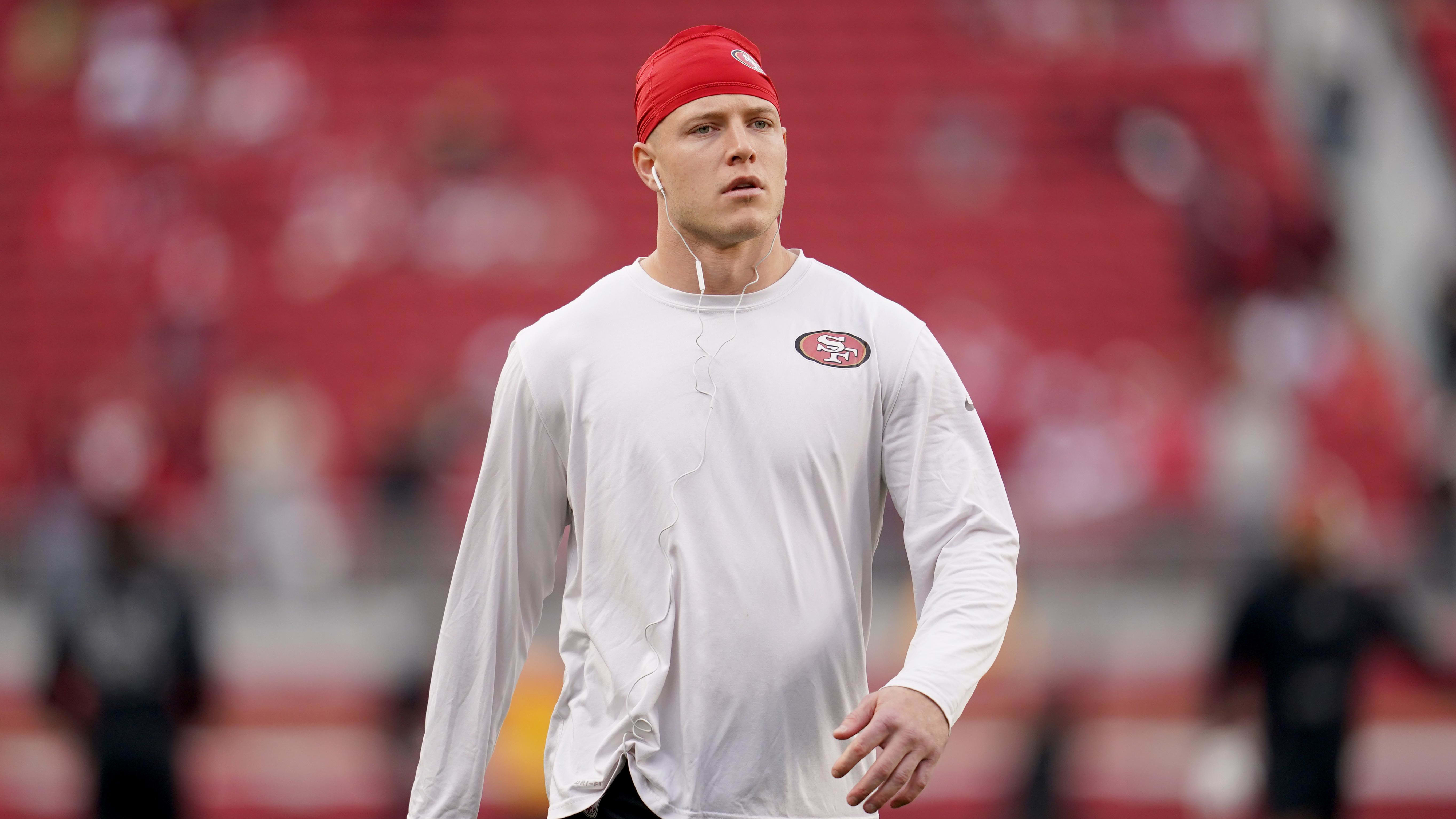 Christian McCaffrey warms up before a game