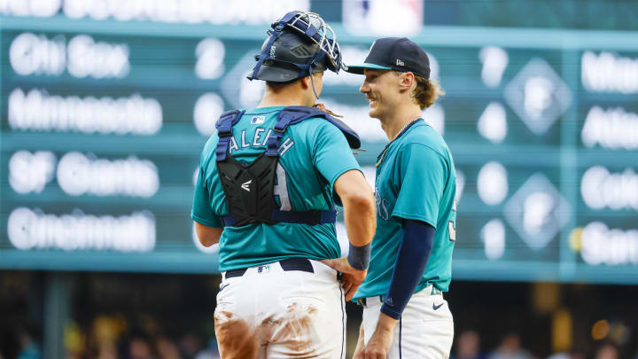 Seattle Mariners starting pitcher Bryce Miller talks with catcher Cal Raleigh on Aug. 3 against the Philadelphia Phillies at T-Mobile Park.