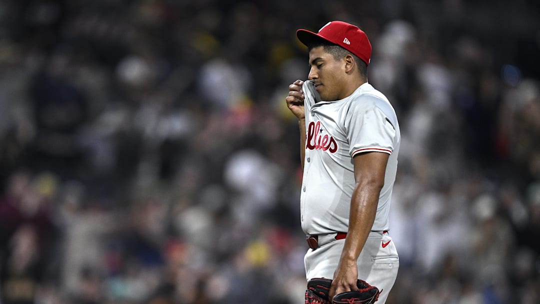 Apr 27, 2024; San Diego, California, USA; Philadelphia Phillies starting pitcher Ranger Suárez (55) wipes his face after a home run hit by San Diego Padres third baseman Eguy Rosario (not pictured) during the eighth inning at Petco Park.