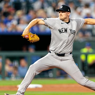 Jun 11, 2025; Kansas City, Missouri, USA; New York Yankees pitcher Brent Headrick (47) pitches during the eighth inning against the Kansas City Royals  at Kauffman Stadium. Mandatory Credit: William Purnell-Imagn Images
