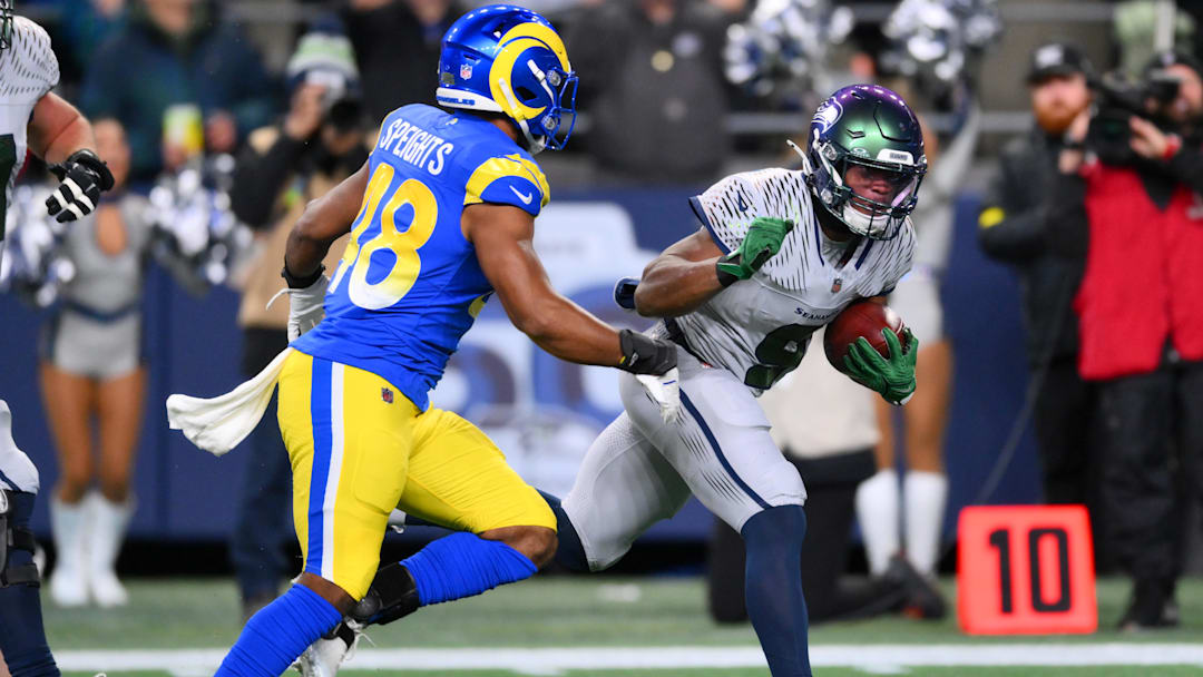 Seattle Seahawks running back Kenneth Walker III runs against Los Angeles Rams linebacker Omar Speights.