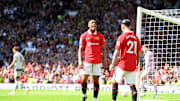 Manchester United berhasil mengatasi perlawanan Wolves, Sabtu (13/5)