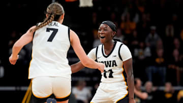 Iowa guard Chit-Chat Wright (11) high-fives Iowa guard Addie Deal (7) after Deal made a 3-pointer Nov. 9, 2025 during a women’s basketball game against the Evansville Purple Aces at Carver-Hawkeye Arena in Iowa City, Iowa.