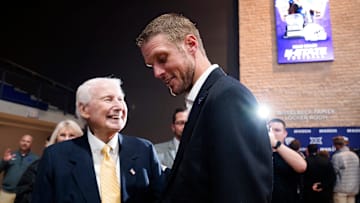 Kansas State new head football coach Collin Klein talks with former football coach Bill Snyder during his introduction ceremony at Morgan Family Arena on Dec. 5, 2025.