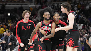 Mar 27, 2025; Chicago, Illinois, USA; Chicago Bulls guard Coby White (0) celebrates his three point basket against the Los Angeles Lakers with guard Josh Giddey (3) and teammates during the second half at United Center. Mandatory Credit: David Banks-Imagn Images