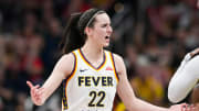 Indiana Fever guard Caitlin Clark (22) talks to Seattle Storm guard Victoria Vivians (35) during a WNBA game at Gainbridge Fieldhouse in Indianapolis.