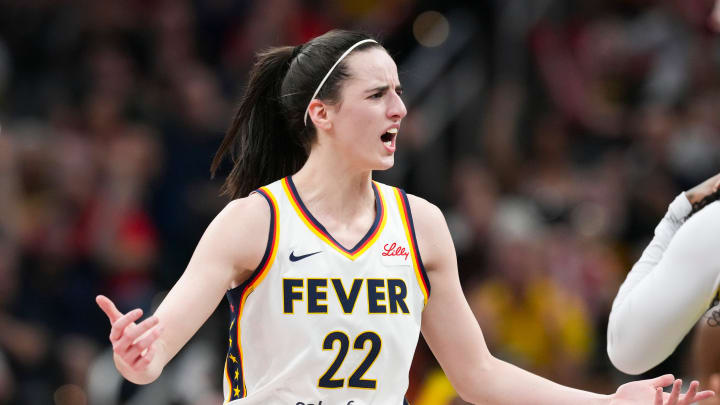 Indiana Fever guard Caitlin Clark (22) talks to Seattle Storm guard Victoria Vivians (35) during a WNBA game at Gainbridge Fieldhouse in Indianapolis.