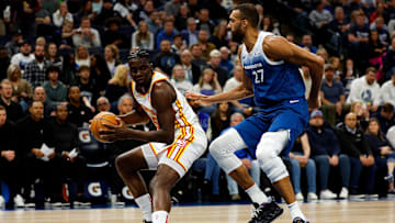 Clint Capela #15 of the Atlanta Hawks goes to work against Rudy Gobert #27 of the Minnesota Timberwolves.