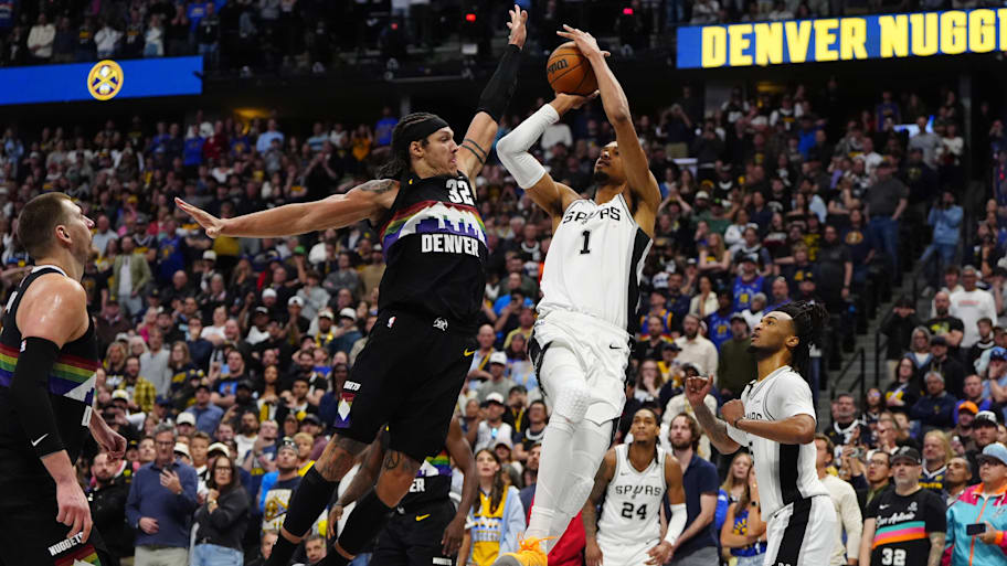 Spurs forward Victor Wembanyama prepares to shoot the ball over Nuggets forward Aaron Gordon.