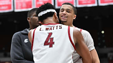Feb 8, 2025; Pullman, Washington, USA; Washington State Cougars guard Isaiah Watts, right, celebrates with forward LeJuan Watts (4) during a game against the Pepperdine Waves in the second half at Friel Court at Beasley Coliseum. Washington State Cougars won 87-86. Mandatory Credit: James Snook-Imagn Images