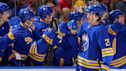 Dec 11, 2024; Buffalo, New York, USA;  Buffalo Sabres defenseman Owen Power (25) celebrates his goal with teammates during the third period against the New York Rangers at KeyBank Center. Mandatory Credit: Timothy T. Ludwig-Imagn Images