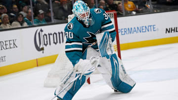 Jan 27, 2025; San Jose, California, USA;  San Jose Sharks goaltender Yaroslav Askarov (30) clears the puck during the first period against the Pittsburgh Penguins at SAP Center at San Jose. Mandatory Credit: David Gonzales-Imagn Images