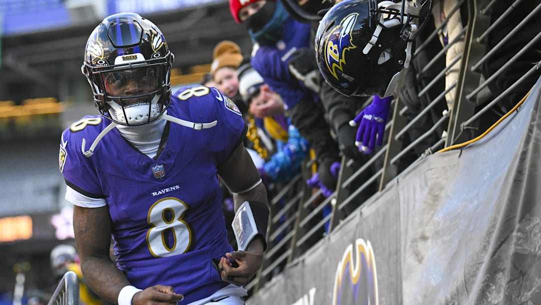 Jan 4, 2025; Baltimore, Maryland, USA;  Baltimore Ravens quarterback Lamar Jackson (8) looks towards the crowds while entering the field before the game against the Cleveland Browns at M&T Bank Stadium. Mandatory Credit: Tommy Gilligan-Imagn Images