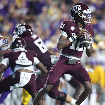 Oct 25, 2025; Baton Rouge, Louisiana, USA; Texas A&M Aggies quarterback Marcel Reed (10) drops to throw during the first half against the Louisiana State Tigers at Tiger Stadium. Mandatory Credit: Stephen Lew-Imagn Images