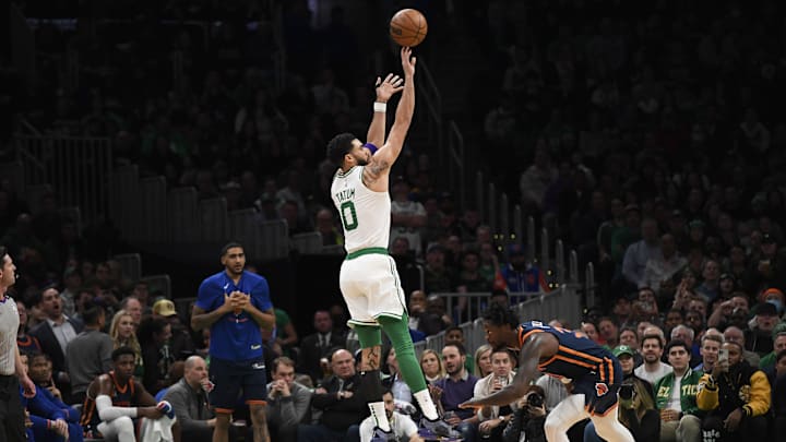 Celtics forward Tatum shoots the ball over then-New York Knicks forward Julius Randle.
