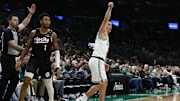 Mar 5, 2025; Boston, Massachusetts, USA; Boston Celtics guard Payton Pritchard (11) follows through on a three point basket as Portland Trail Blazers guard Anfernee Simons (1) looks on during the first quarter at TD Garden. Mandatory Credit: Winslow Townson-Imagn Images