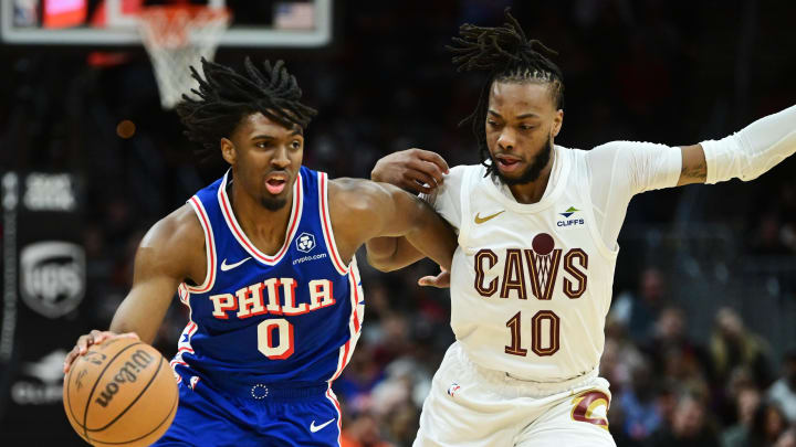 Mar 29, 2024; Cleveland, Ohio, USA; Philadelphia 76ers guard Tyrese Maxey (0) drives to the basket against Cleveland Cavaliers guard Darius Garland (10) during the first half at Rocket Mortgage FieldHouse. Mandatory Credit: Ken Blaze-USA TODAY Sports
