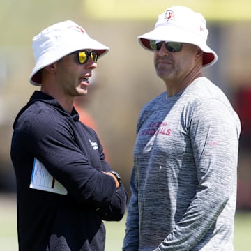 Jun 10, 2025; Tempe, AZ, USA; Arizona Cardinals head coach Jonathan Gannon (left) with general manager Monti Ossenfort during minicamp at the teams Arizona Cardinals Training Facility. Mandatory Credit: Mark J. Rebilas-Imagn Images