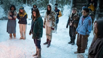 (L-R): Nuha Jes Izman as Teen Crystal, Samantha Hanratty as Teen Misty, Alexa Barajas as Teen Mari, Sophie Nélisse as Teen Shauna, Courtney Eaton as Teen Lottie, Nia Sondaya as Teen Akilah, Sophie Thatcher as Teen Natalie, Jasmin Savoy Brown as Teen Taissa, Steven Krueger as Ben Scott and Liv Hewson as Teen Van in YELLOWJACKETS, Season 2. Photo Credit: Kailey Schwerman/SHOWTIME.
