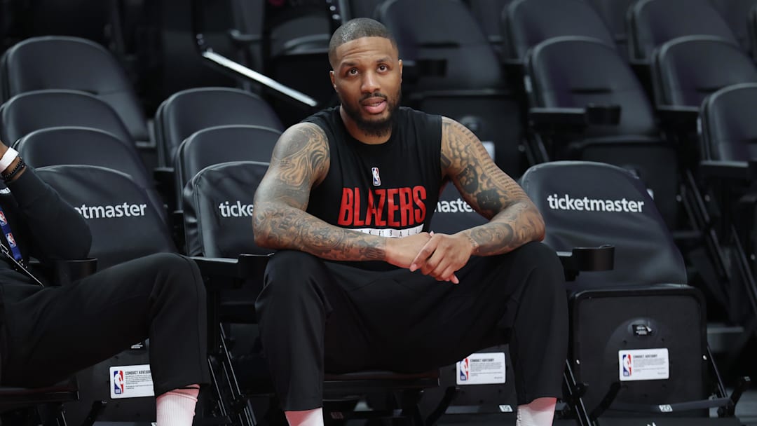 Apr 10, 2026; Portland, Oregon, USA;  Portland Trail Blazers guard Damian Lillard (0) watches his teammates during warm ups before the Trail Blazers play against the LA Clippers at Moda Center. Mandatory Credit: Jaime Valdez-Imagn Images