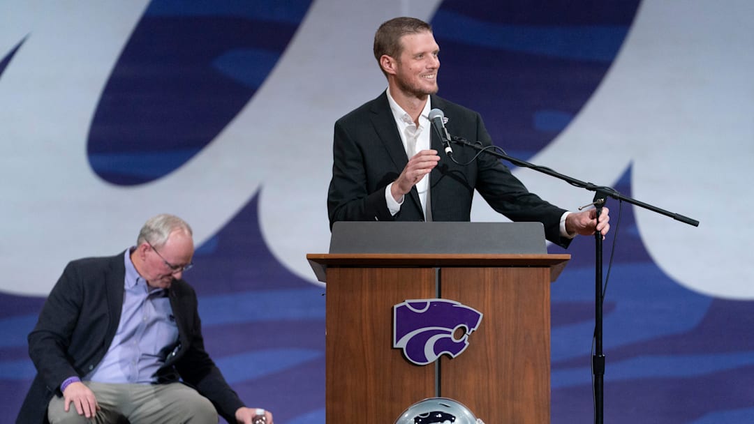 Kansas State's new head football coach Collin Klein smiles as he makes remarks at his introduction ceremony at Morgan Family Arena on Dec. 5, 2025.