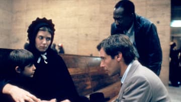 Lukas Haas, Kelly McGillis, Brent Jennings, and Harrison Ford in ‘Witness.’