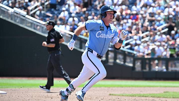 Jun 17, 2026; Omaha, NE, USA;  North Carolina Tar Heels third baseman Cooper Nicholson (1) runs out a triple against the North Carolina Tar Heels during the third inning at Charles Schwab Field. Mandatory Credit: Steven Branscombe-Imagn Images