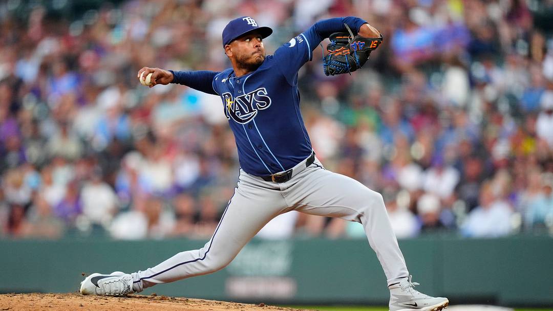 Aug 4, 2026; Denver, Colorado, USA; Tampa Bay Rays starting pitcher Freddy Peralta (51) delivers a pitch in the fourth inning against the Colorado Rockies at Coors Field. Mandatory Credit: Ron Chenoy-Imagn Images