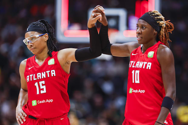 Atlanta Dream guard Allisha Gray (15) celebrates with guard Rhyne Howard (10) 