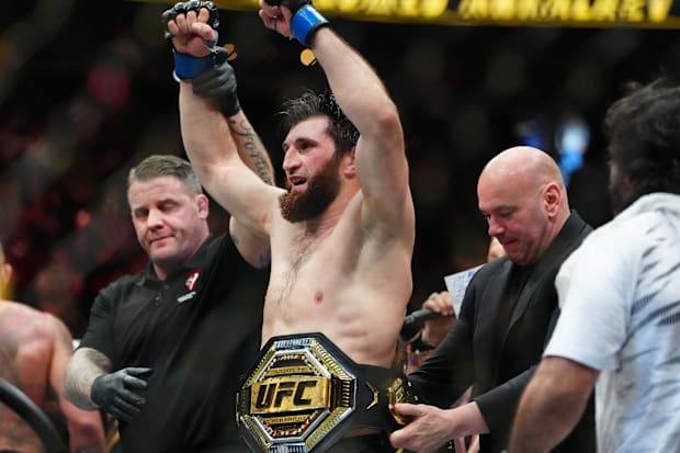 Magomed Ankalaev (blue gloves) reacts after defeating Alex Pereira (not pictured) during UFC 313 at T-Mobile Arena. 
