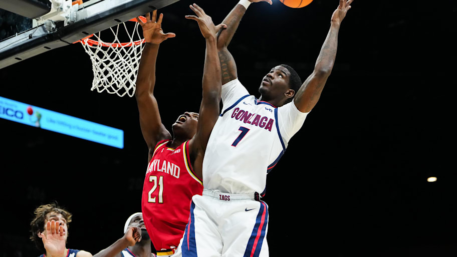 Gonzaga guard Tyon Grant-Foster grabs a rebound away from Maryland forward Pharrel Payne at the Players Era Championship.