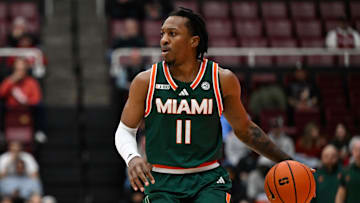 Jan 22, 2025; Stanford, California, USA; Miami (FL) Hurricanes guard A.J. Staton-McCray (11) dribbles against the Stanford Cardinal in the first half at Maples Pavilion. Mandatory Credit: Eakin Howard-Imagn Images