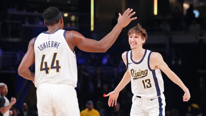 Feb 16, 2024; Indianapolis, Indiana, USA; Team Detlef forward Matas Buzelis (13) of the G League Ignite reacts after a play with center Oscar Tshiebwe (44) of the Indiana Mad Ants during a Rising Stars semifinal game at Gainbridge Fieldhouse. Mandatory Credit: Kyle Terada-USA TODAY Sports