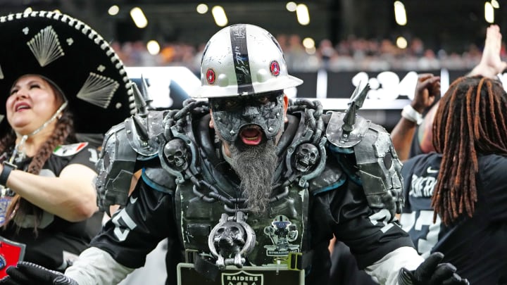 Oct 15, 2023; Paradise, Nevada, USA; A Las Vegas Raiders fan cheers after the Raiders defeated the New England Patriots 21-17 at Allegiant Stadium. Mandatory Credit: Stephen R. Sylvanie-USA TODAY Sports