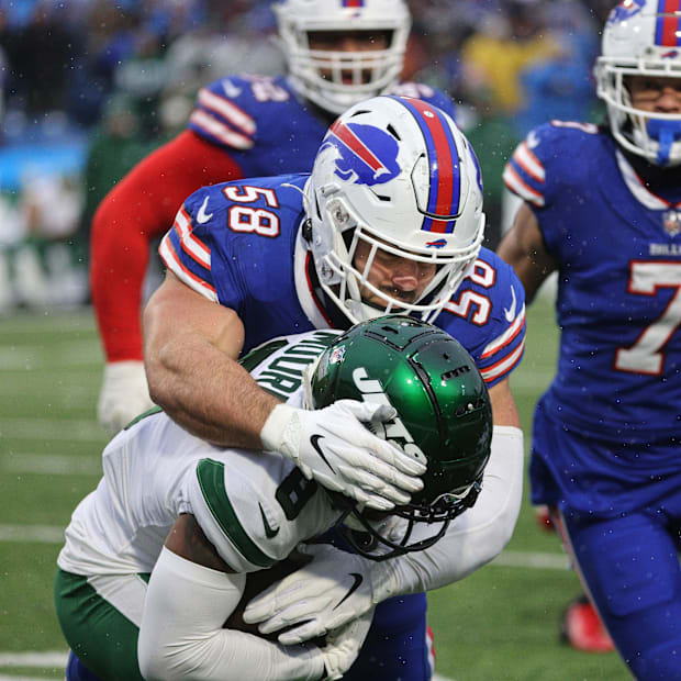 Bills Matt Milano makes the tackle on Jets Elijah Moore