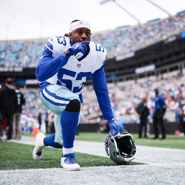 Dallas Cowboys defensive end James Houston kneels before the start of the game against the Carolina Panthers 