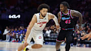 Nov 29, 2025; Miami, Florida, USA; Detroit Pistons guard Cade Cunningham (2) drives to the basket against Miami Heat guard Davion Mitchell (45) during the second half at Kaseya Center. Mandatory Credit: Rhona Wise-Imagn Images