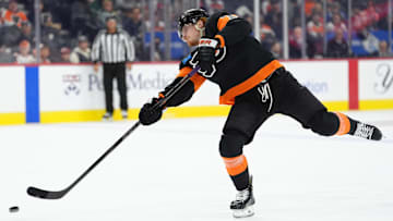 Apr 12, 2025; Philadelphia, Pennsylvania, USA; Philadelphia Flyers right wing Owen Tippett (74) shoots the puck against the New York Islanders in the second period at Wells Fargo Center.