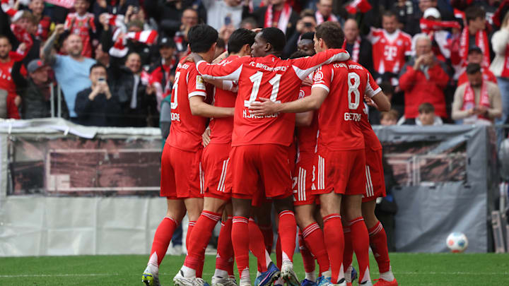 Bayern Munich players celebrating a goal against VfB Stuttgart.