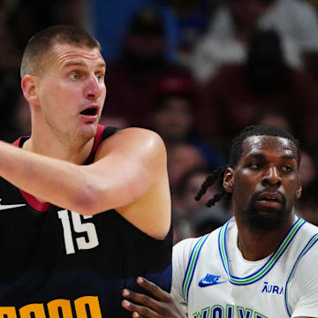 May 19, 2024; Denver, Colorado, USA; Minnesota Timberwolves center Naz Reid (11) defends Denver Nuggets center Nikola Jokic (15) in the first half in game seven of the second round for the 2024 NBA playoffs at Ball Arena. 