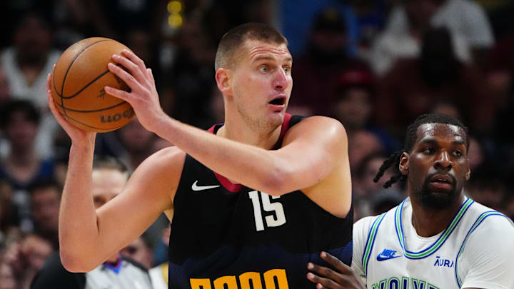 May 19, 2024; Denver, Colorado, USA; Minnesota Timberwolves center Naz Reid (11) defends Denver Nuggets center Nikola Jokic (15) in the first half in game seven of the second round for the 2024 NBA playoffs at Ball Arena. 