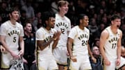 Purdue Boilermakers yell in excitement from the sidelines