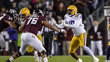 Nov 26, 2022; College Station, Texas, USA; Texas A&M Aggies offensive lineman Reuben Fatheree II (76) and LSU Tigers defensive end BJ Ojulari (18) in action during the game between the Texas A&M Aggies and the LSU Tigers at Kyle Field. Mandatory Credit: Jerome Miron-Imagn Images