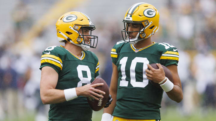 Aug 26, 2023; Green Bay, Wisconsin, USA;  Green Bay Packers quarterbacks Sean Clifford (8) a dn Jordan Love (10) talk on the field during warmups prior to the game against the Seattle Seahawks at Lambeau Field. Mandatory Credit: Jeff Hanisch-USA TODAY Sports