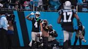 Nov 30, 2025; Charlotte, North Carolina, USA; Carolina Panthers wide receiver Tetairoa McMillan (4) celebrates after scoring a touchdown during the fourth quarter against the Los Angeles Rams at Bank of America Stadium. Mandatory Credit: Scott Kinser-Imagn Images