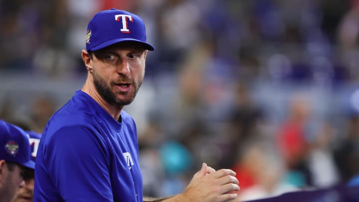 Jun 2, 2024; Miami, Florida, USA; Texas Rangers starting pitcher Max Scherzer (31) looks on from inside the dugout against the Miami Marlins at loanDepot Park. 